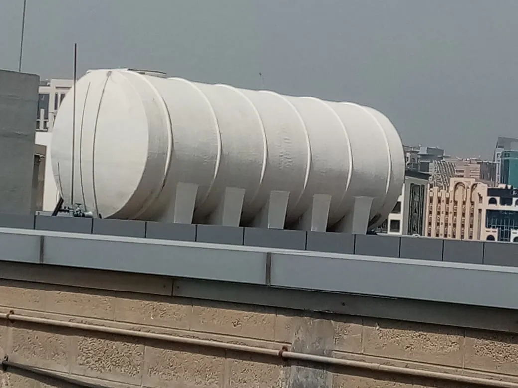 Rooftop water tank installation, UAE building — photo 1